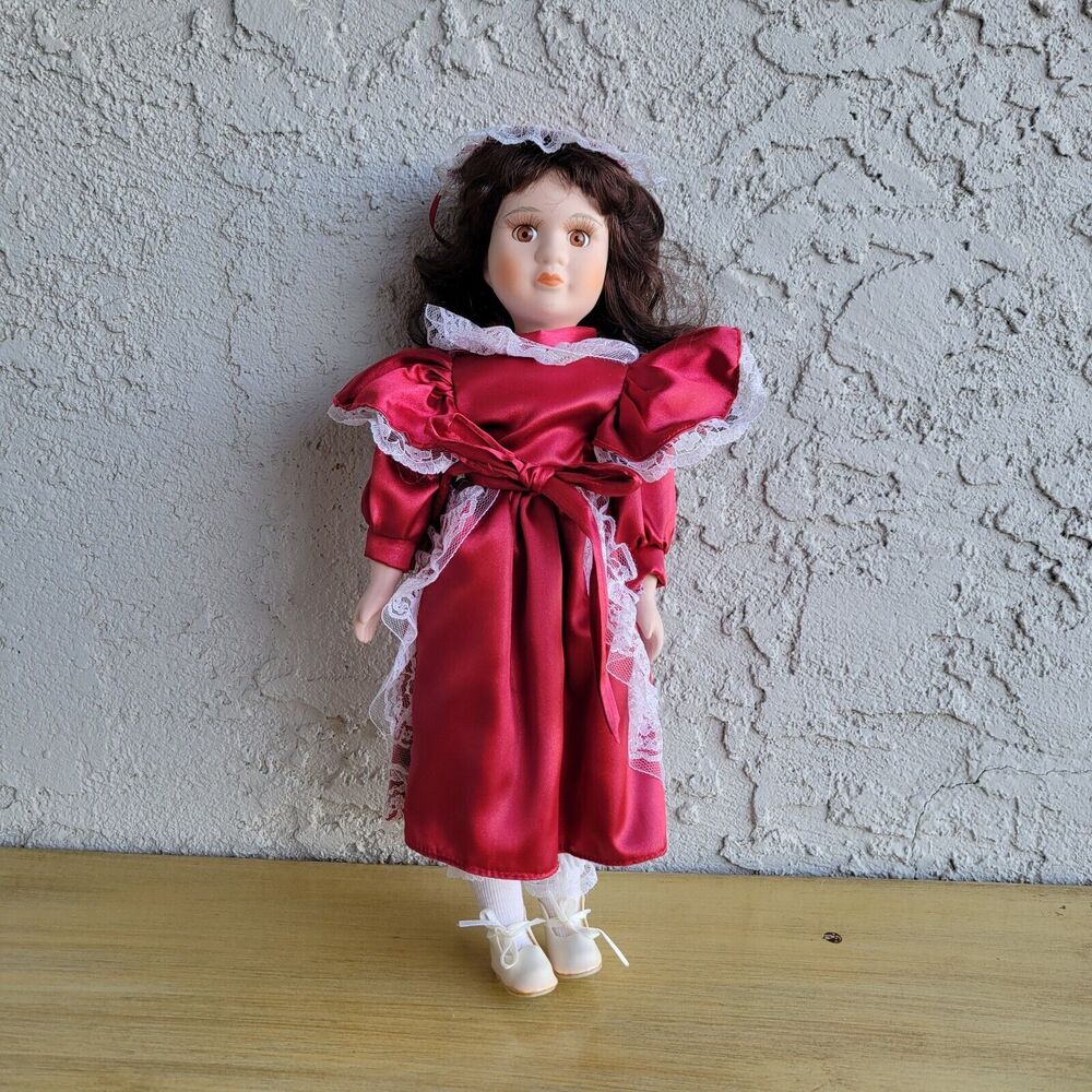 Vintage porcelain doll with a lively look for collection 15"